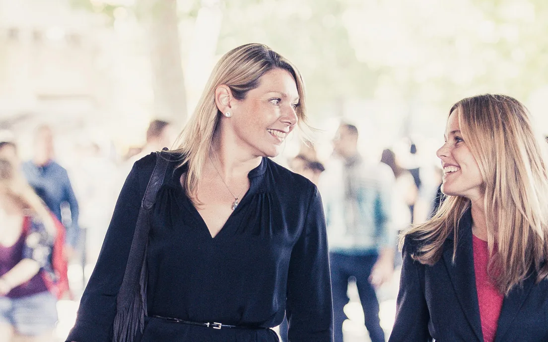 Two colleagues in conversation at a talent event